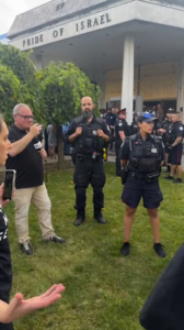Police gather outside Pride of Israel Synagogue, barring access to members of Jews Say No To Genocide. Photo: Courtesy of SURJ Toronto